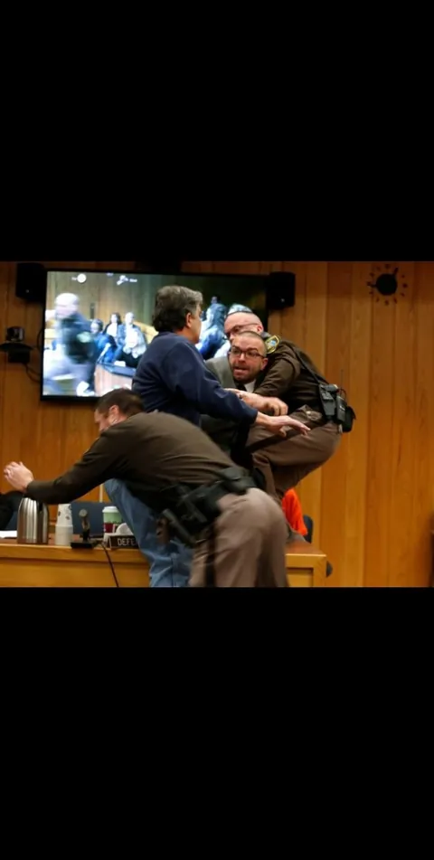 After hearing how Larry Nassar abused hundreds of young athletes, a father of three victims tried to attack him in court, shouting that he wanted “five minutes alone".