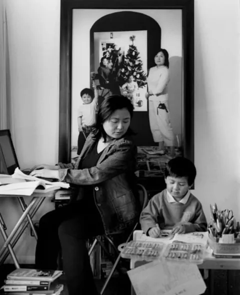 A mother photographs herself and her child over the years, 2001