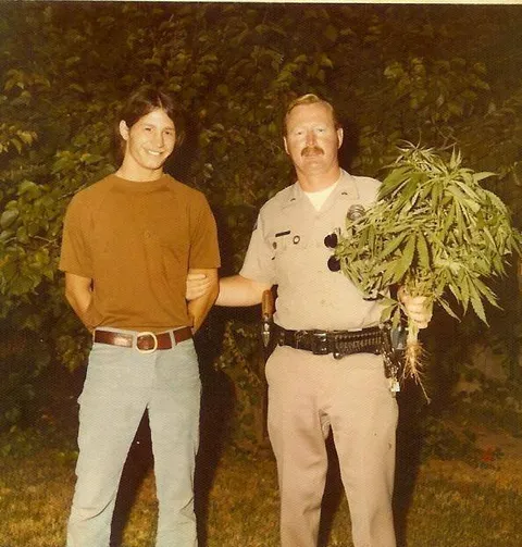 My uncle getting caught growing weed in the backyard. Circa 1970s.