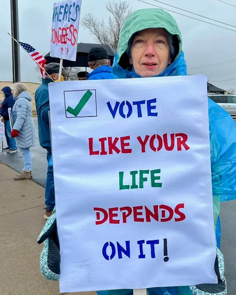 Demonstrators in deep red Barron County, WI remind people of tomorrow's Supreme Court election. [OC]