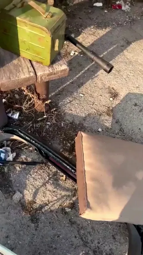 Americans fighting in Ukraine liberate a 50 caliber machine gun from a destroyed Russian tank