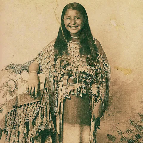 Smiling Kiowa girl, taken at Fort Sill, Oklahoma in 1895. I think I've positive identified her as  Nannie “Muskogee” Tahloweah. Details below. 