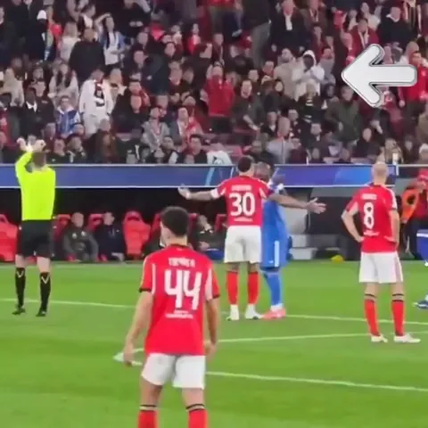 Lone black Benfica fan applauding refs decision to initiate UEFA's anti-racism protocol.