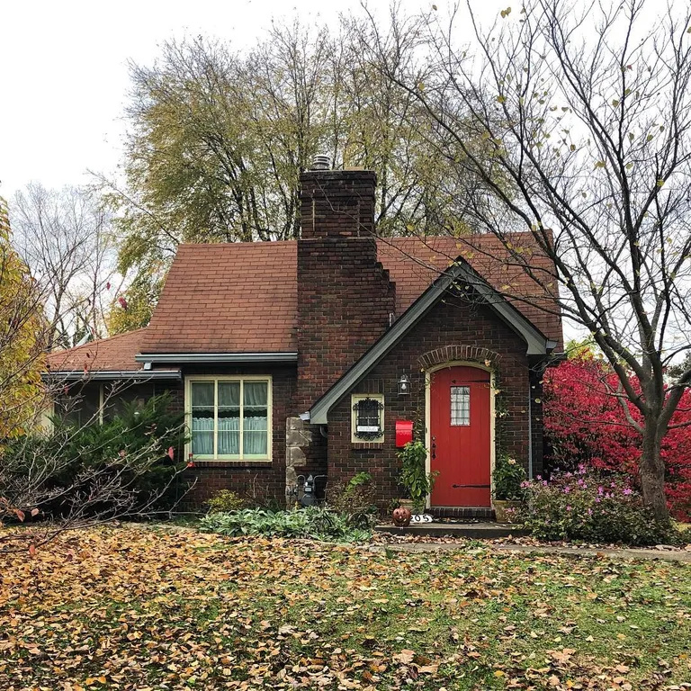 This cute brick cottage is giving me major storybook vibes.