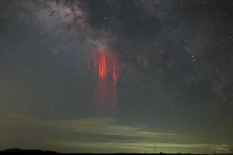 A bright jellyfish sprite beneath the Milky Way