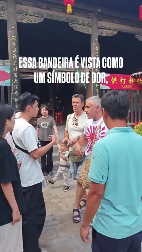 Guy goes to China with the Rising Sun flag on his shirt and gets confronted by the locals