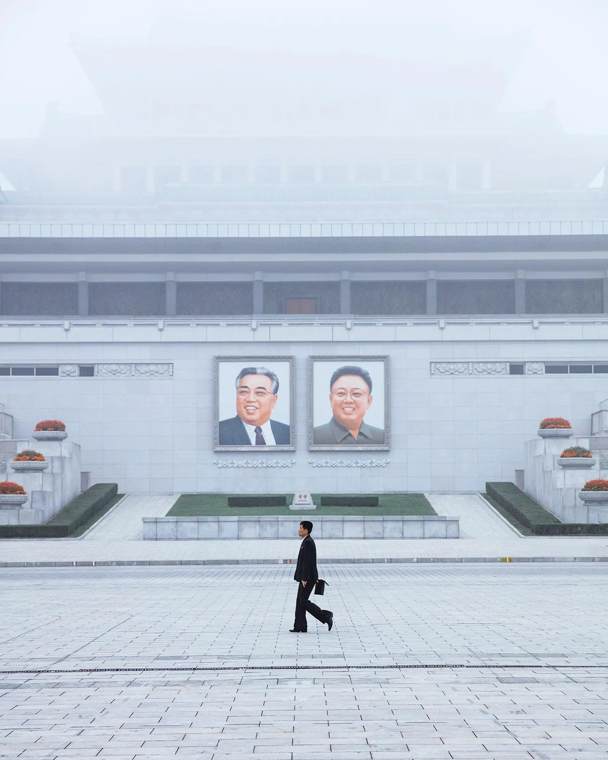 ITAP of a man walking in North Korea [Portrait]