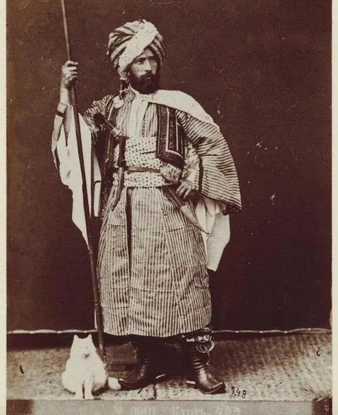 Kurdish warrior and cat (1870s)