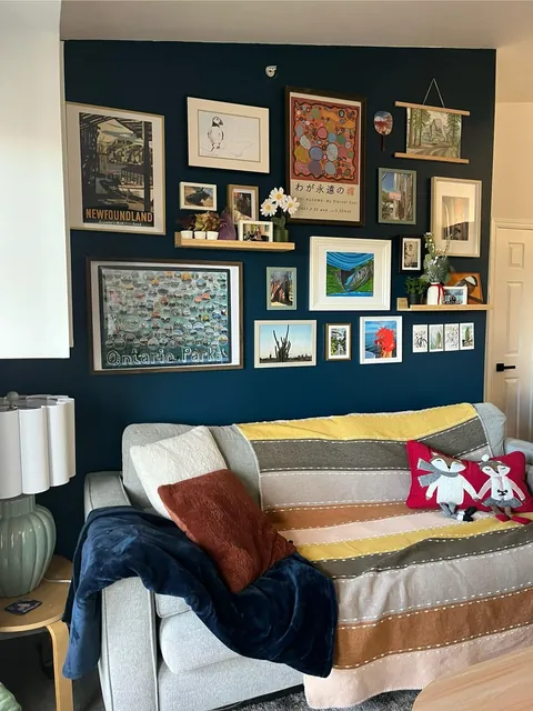 We finally put up our gallery wall in the living room and it feels very cozy!