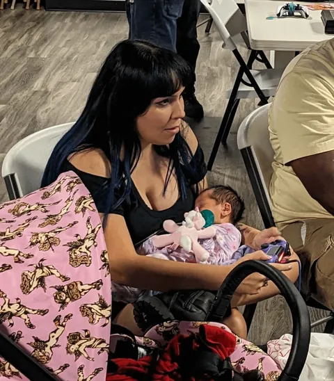 This mom gave birth less than a week ago… then won a Mortal Kombat tournament with her baby in her arms.