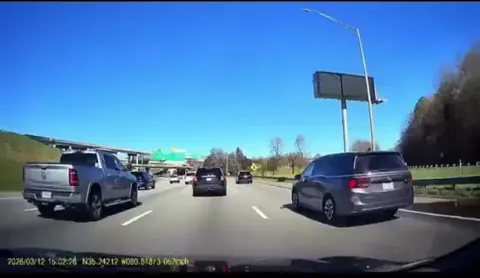 Driver comes to a complete stop on the highway because they needed to make an exit