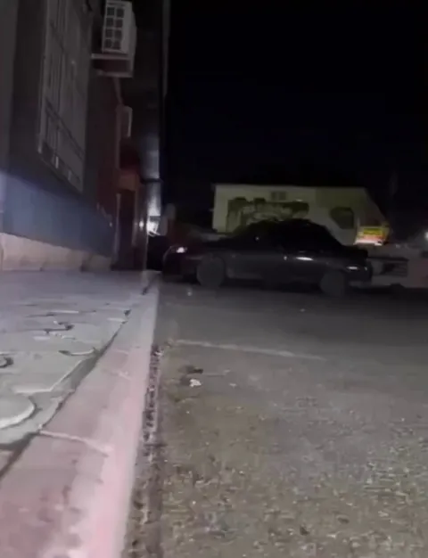 A hedgehog approaches a man so he can remove a piece of tape from its paw, and then runs away.