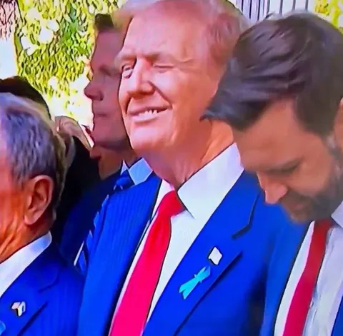 Donald Trump winking at a female photographer during today's 9/11 ceremony