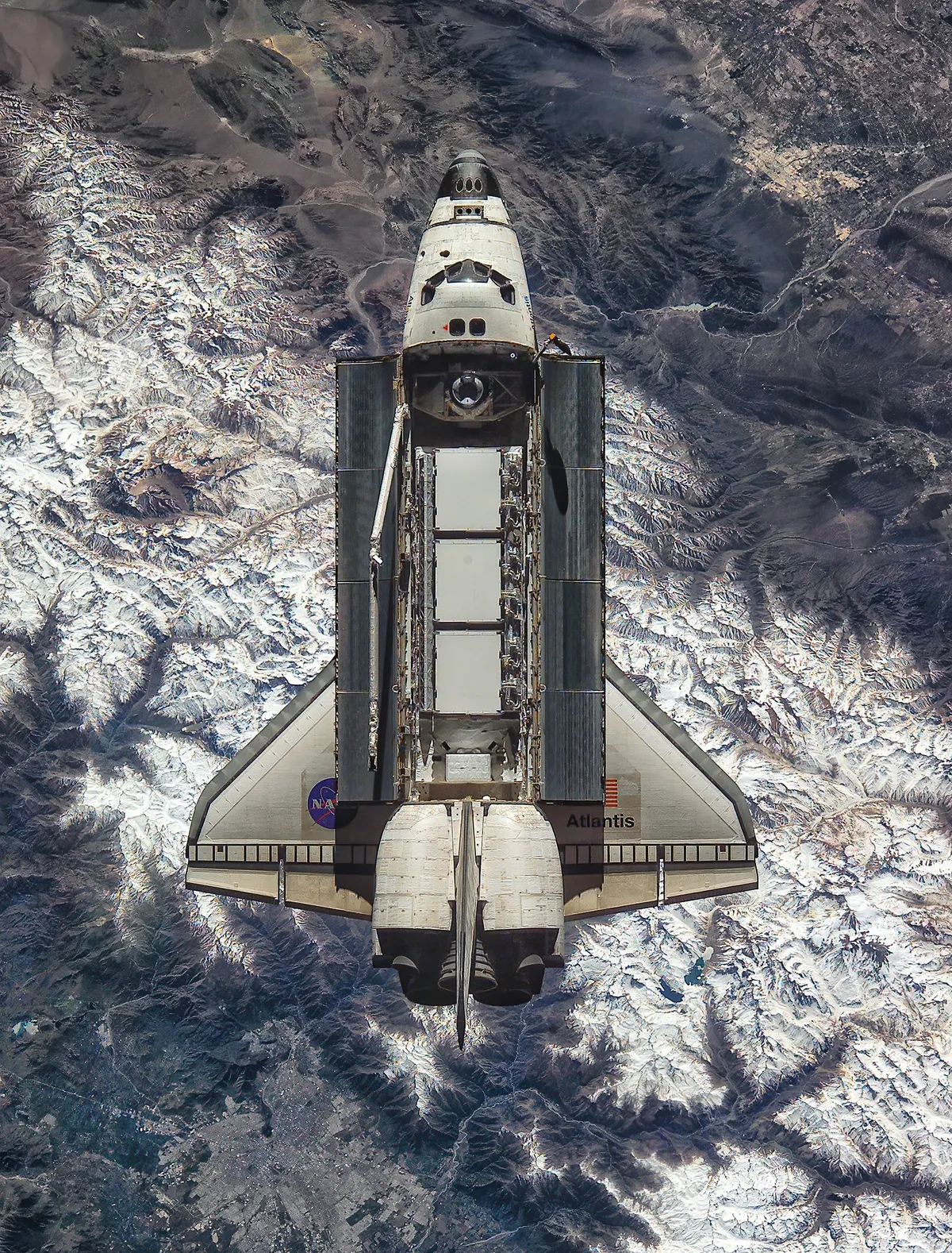 Here's a photo of the Atlantis orbiter above the Chilean Andes, captured from the ISS on October 9, 2002 during STS-112. Santiago is at lower left.