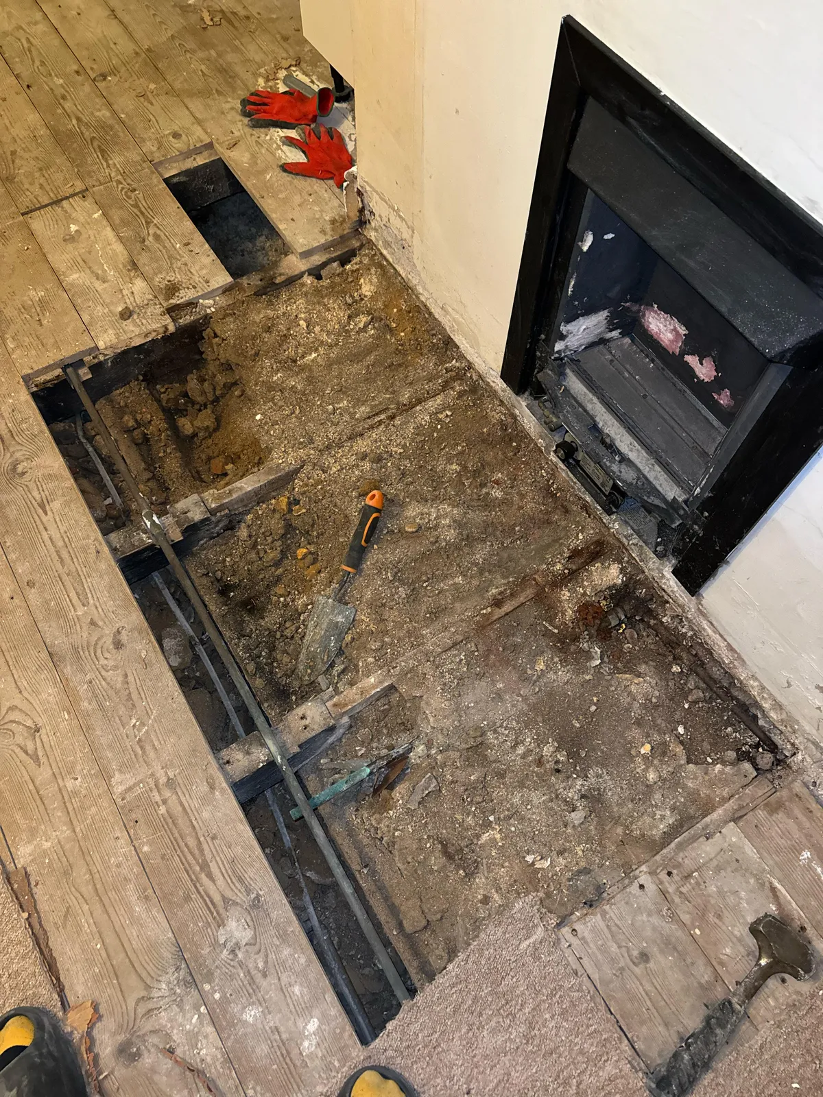 What is all this shit under the floorboards in front of our gas fire?