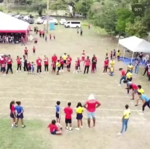 Shelly-Ann-Fraser-Pryce, 8x times Olympic medalist, obliterating other parents at a school event.