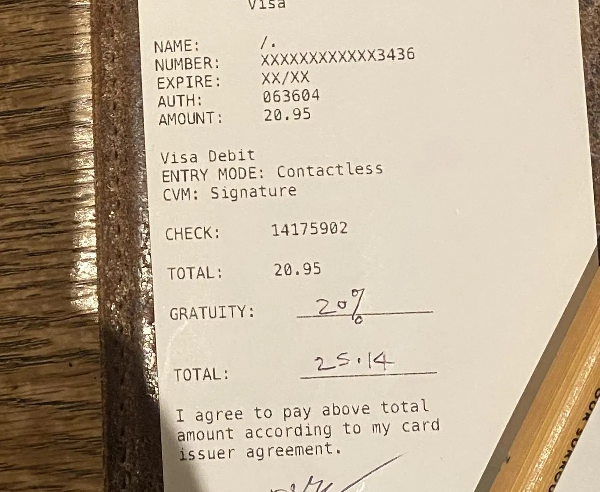 Person that sat at my table before me put % tip on gratuity line instead of dollar amount