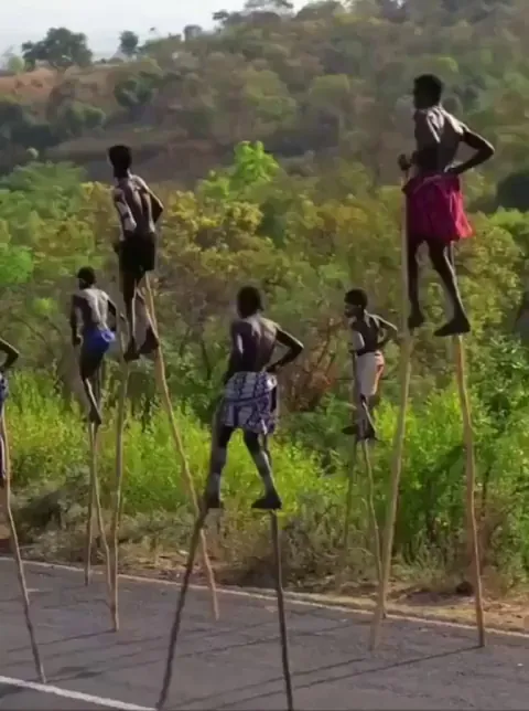 Ethiopia's Banna Tribe use long sticks to avoid snakes in their valley