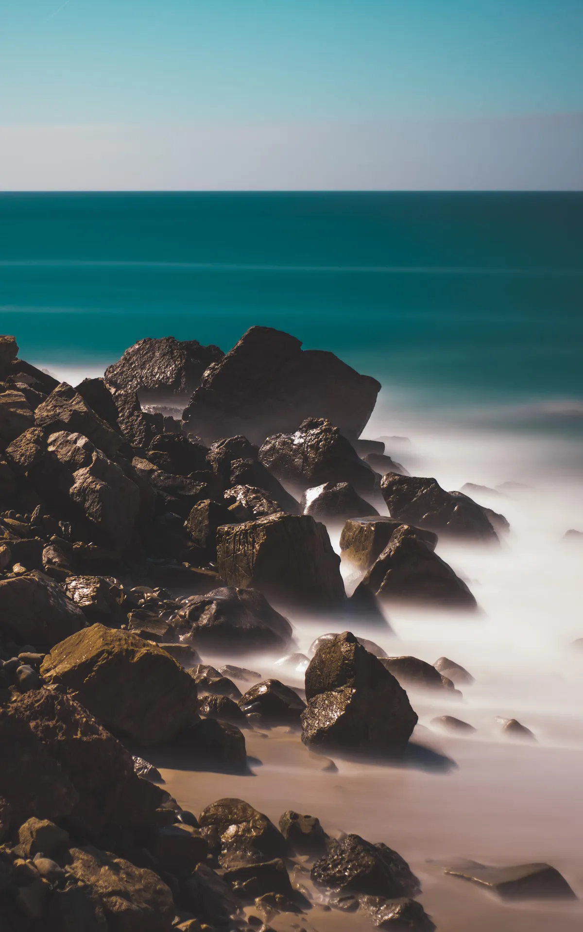 6 minute exposure of some rocks on the shore [edit] [composition]