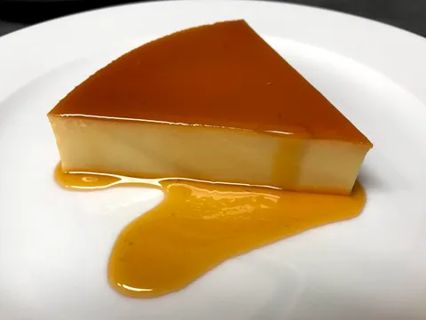 I cut myself a slice of my homemade flan.