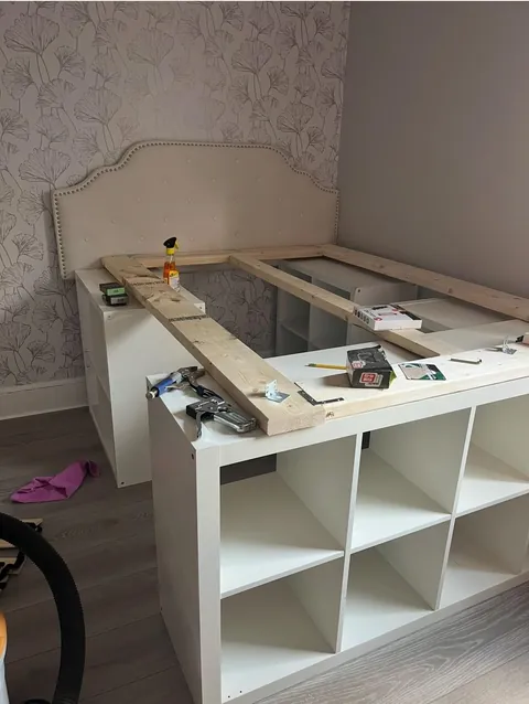 Built a storage bed with thrifted shelves