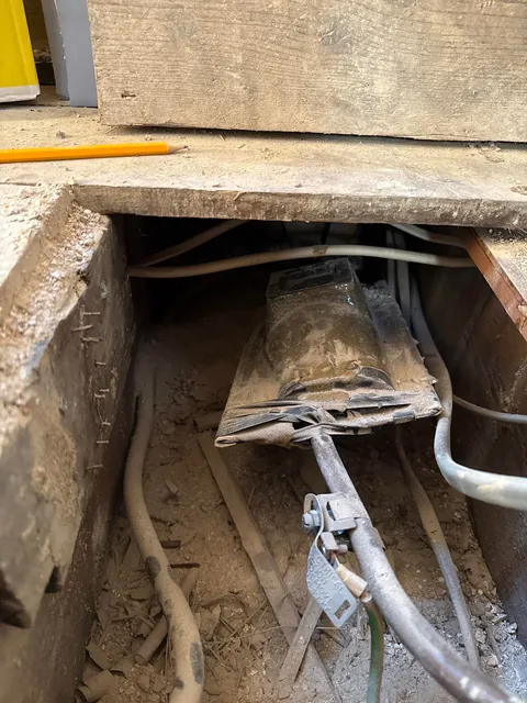What is this ceramic submarine looking thing under my floorboards?