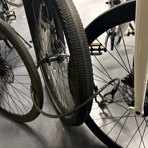 Somebody rolled their bike between my two bikes and locked their front wheel to my front wheels.