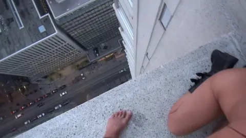 Girl spits cum off of skyscraper