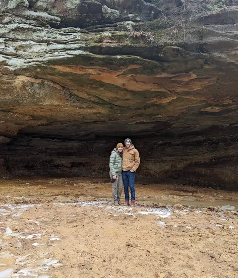 Is building under a huge rock like this safe? My first thought when I say this was earthquakes.
