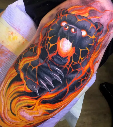 Fresh magma bear on the upper arm! Done by Eric Brunning at Black Rider Tattoo in Vancouver, BC.