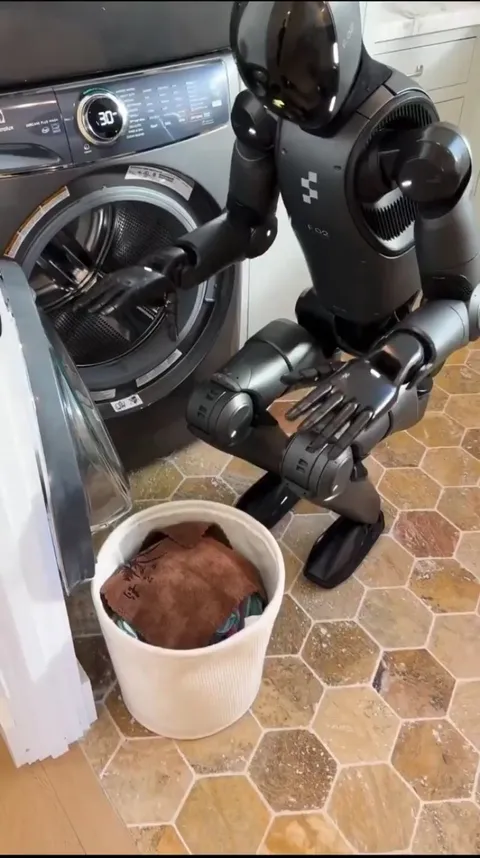 Figure 02 humanoid operating a washing machine