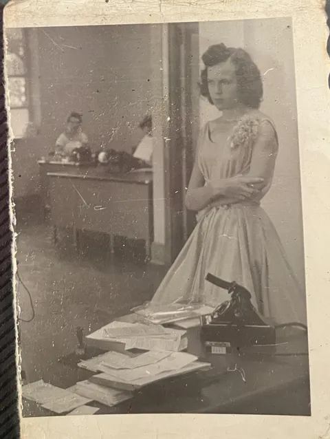 Anyone know what is the device on the desk is? This is my grandmother at one of her jobs sometime around 1956!