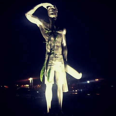 Statue of my cousin who drowned while successfully saving another person at Newport Beach. This is the photo his dad sent my dad after the unveiling.
