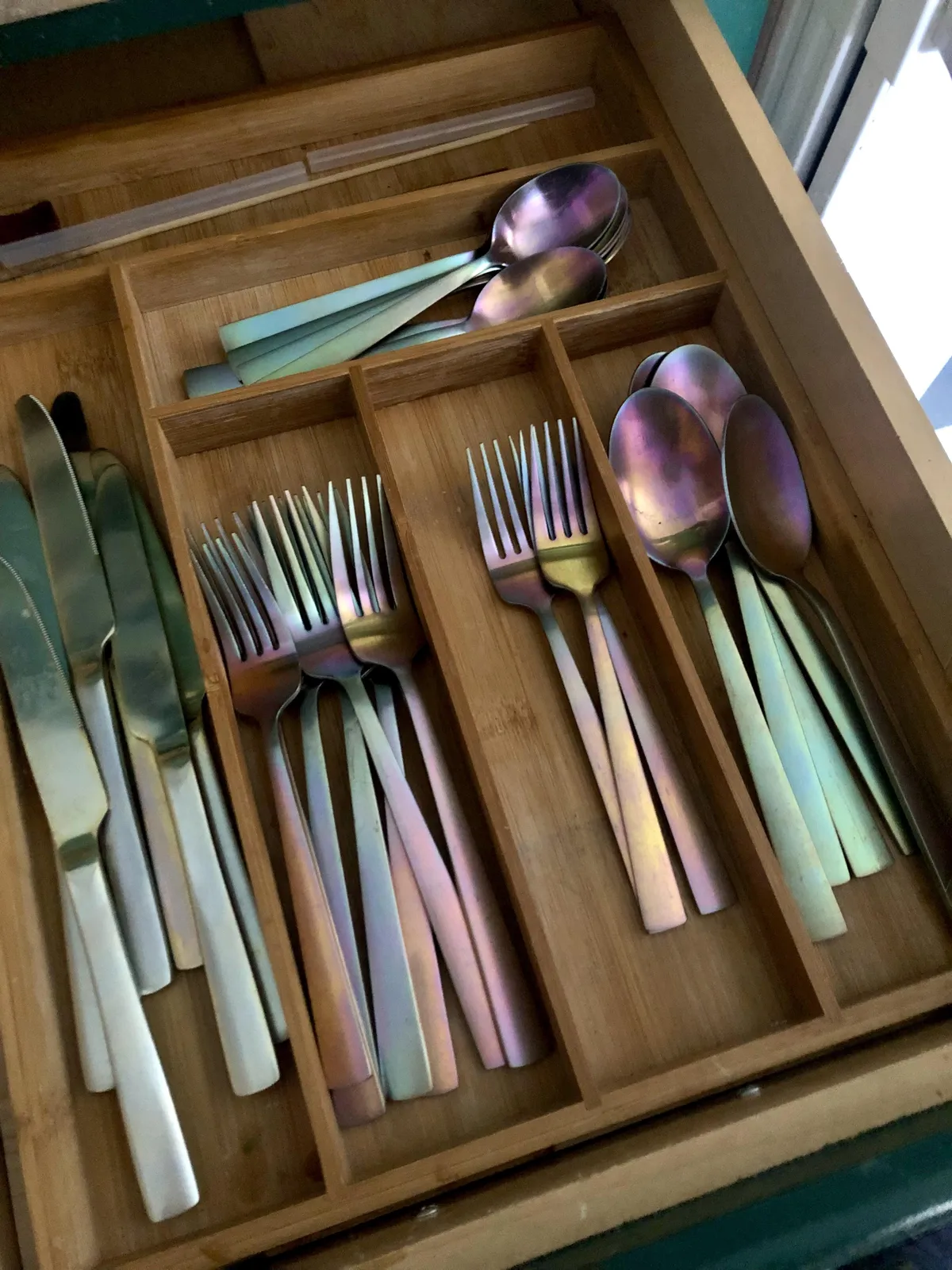 My cutlery used to be gold-coloured but has turned iridescent over time 