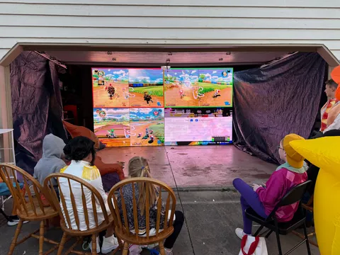 Neighbor plugged in media tiles to have trick or treaters play Mario Kart!