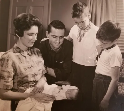 My grandmother holding my dad, 1963
