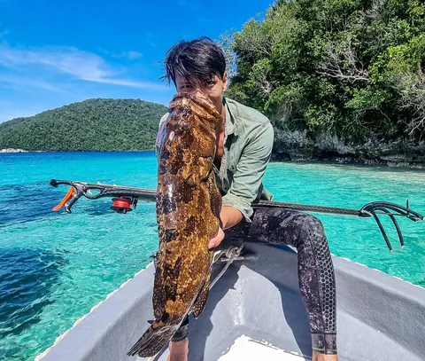 I returned to New Guinea, to a very remote atoll for a month long trip, living off the ocean.