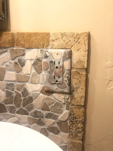 My mom painted this outlet to match the rocks.