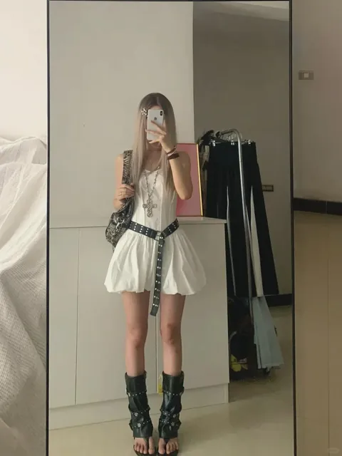 A dress with boots is always a winning match. Love it.