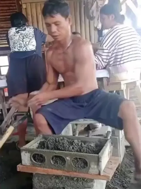 Making concrete blocks by hand