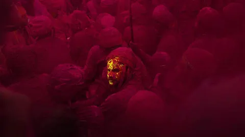 ITAP of a man in crowd during Holi celebrations in India [Portrait]. 