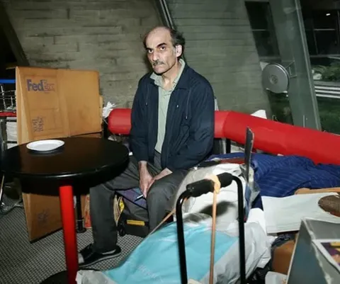 Mehran karimi Nasseri. He lived in terminal 1, Charles de Gaulle airport from 1988-2016. 