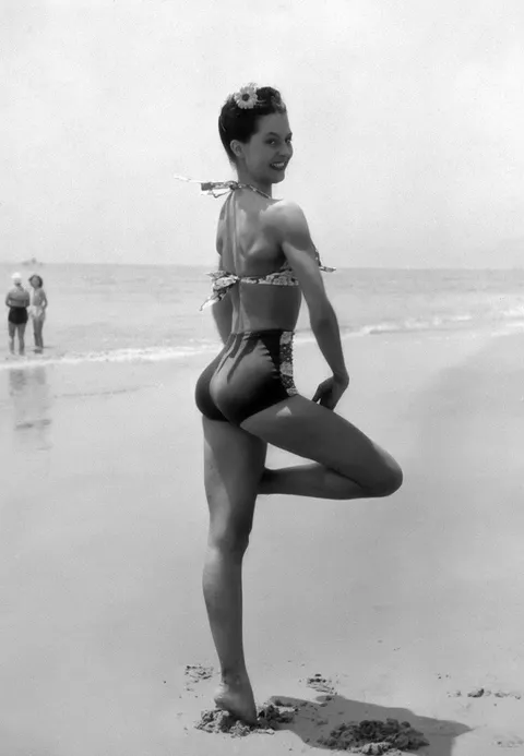 Cyd Charisse, one of old Hollywood's greatest dancers, poses on the beach in Santa Monica, 1945.