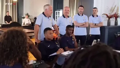 Didier Deschamps congratulates the PSG players for winning the Champions League as the camera pans over to Marcus Thuram