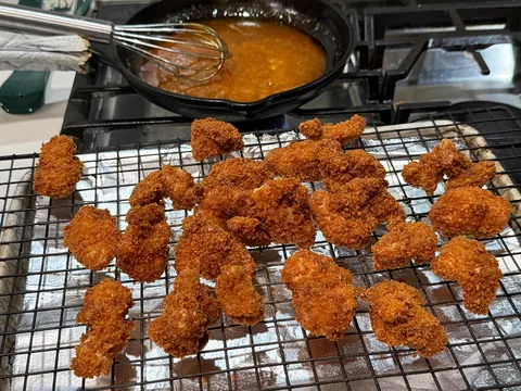 [homemade] boneless wings or saucy nugs or popcorn chicken or something.