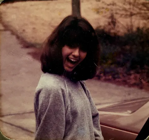 My (now) wife on her way to high school, 1984