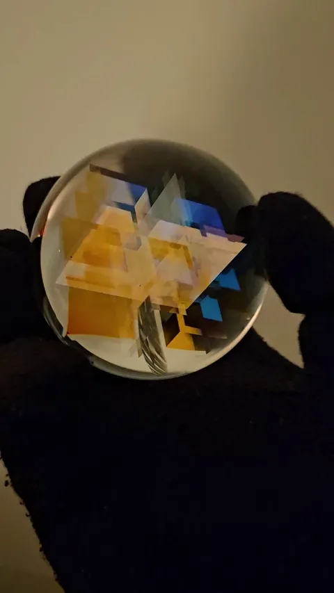 This glass sphere sucks you into an oddly satisfying rainbow dimension!