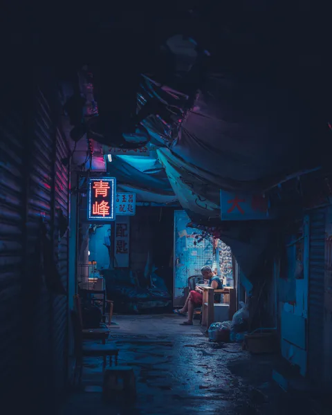 ITAP of a man in an alley on a rainy night