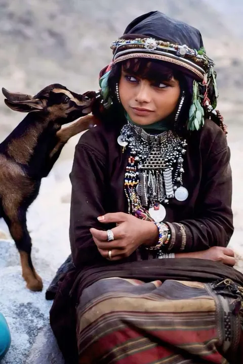 A Yemeni girl with her goat. 1985
