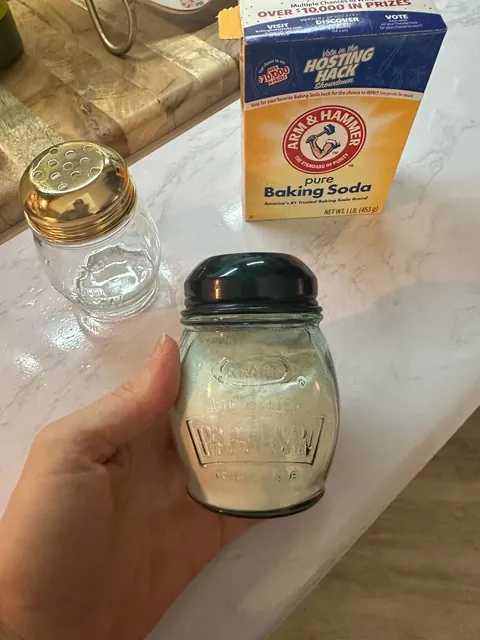 Thrift some vintage parm jars to use for baking soda for easy fridge deodorizing and by the sink to wash produce